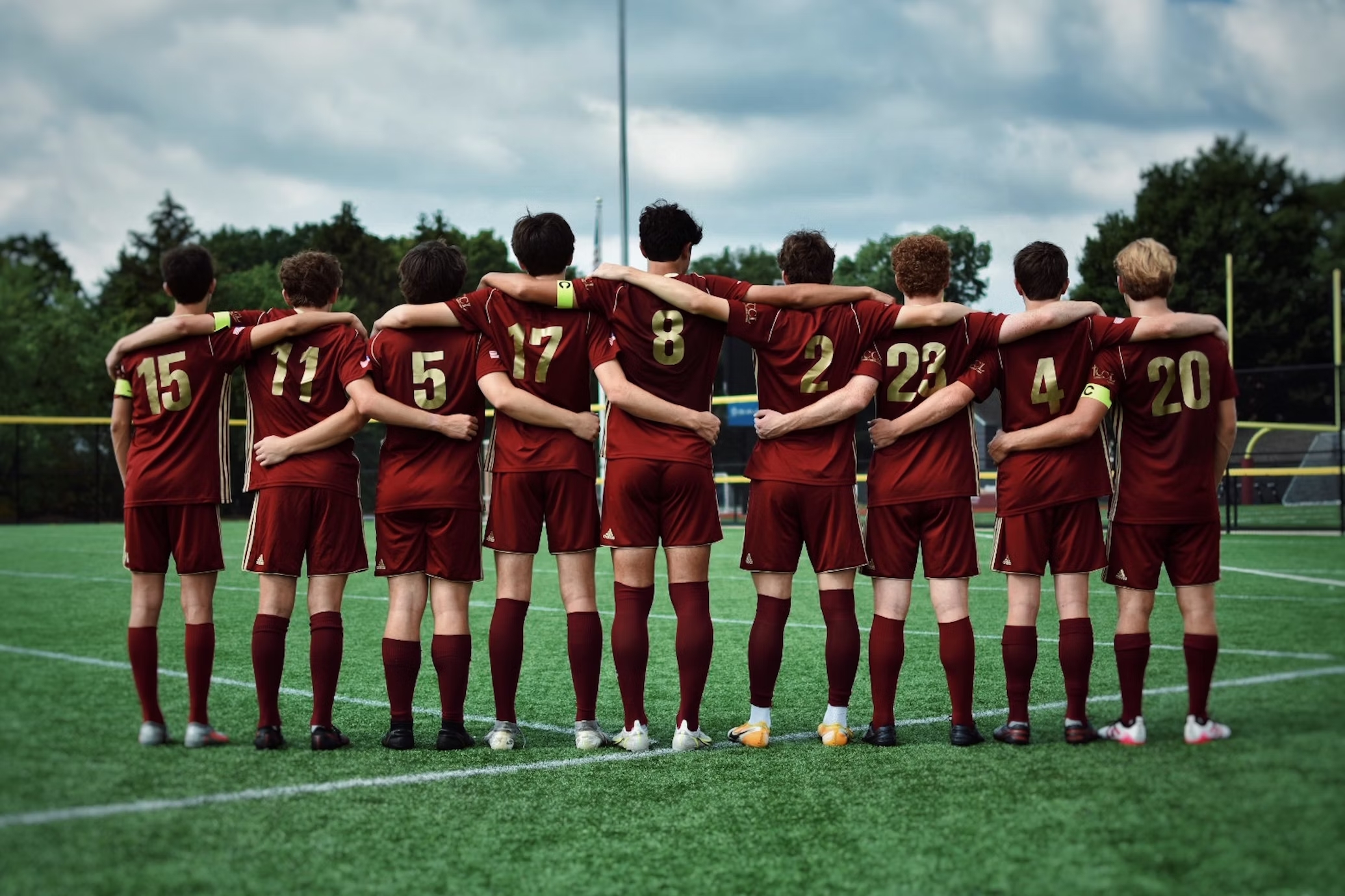 a group of football players posing for a picture